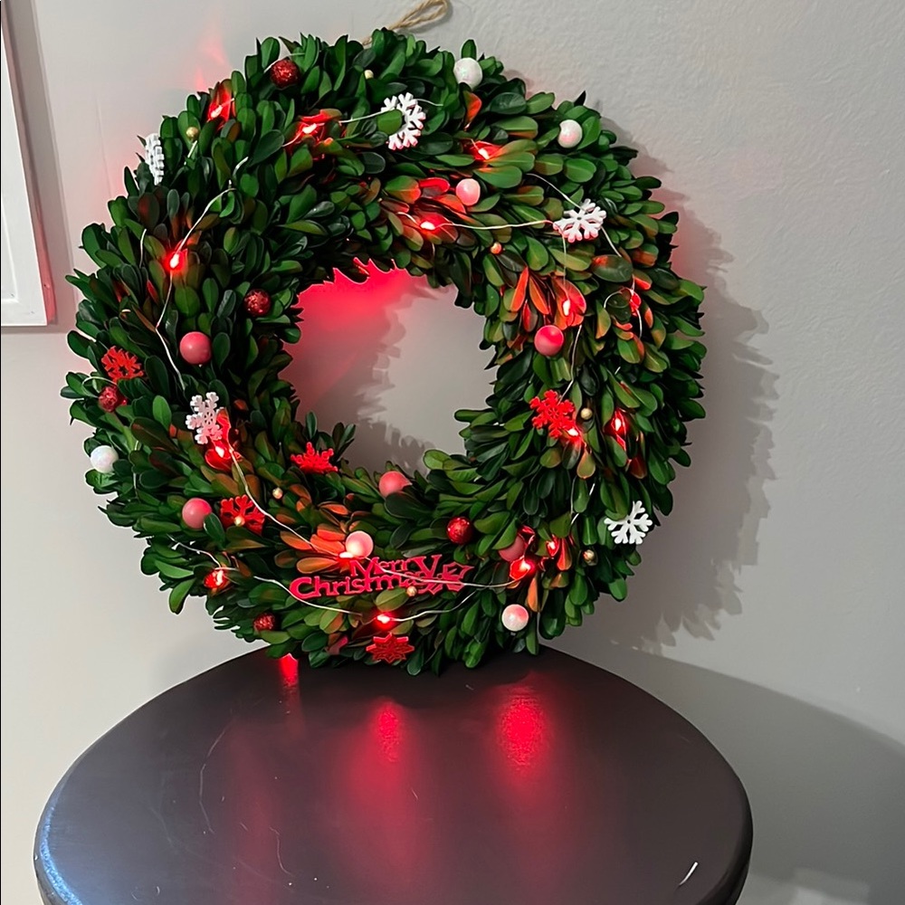 Festive Green Holiday Wreath with Red Accents